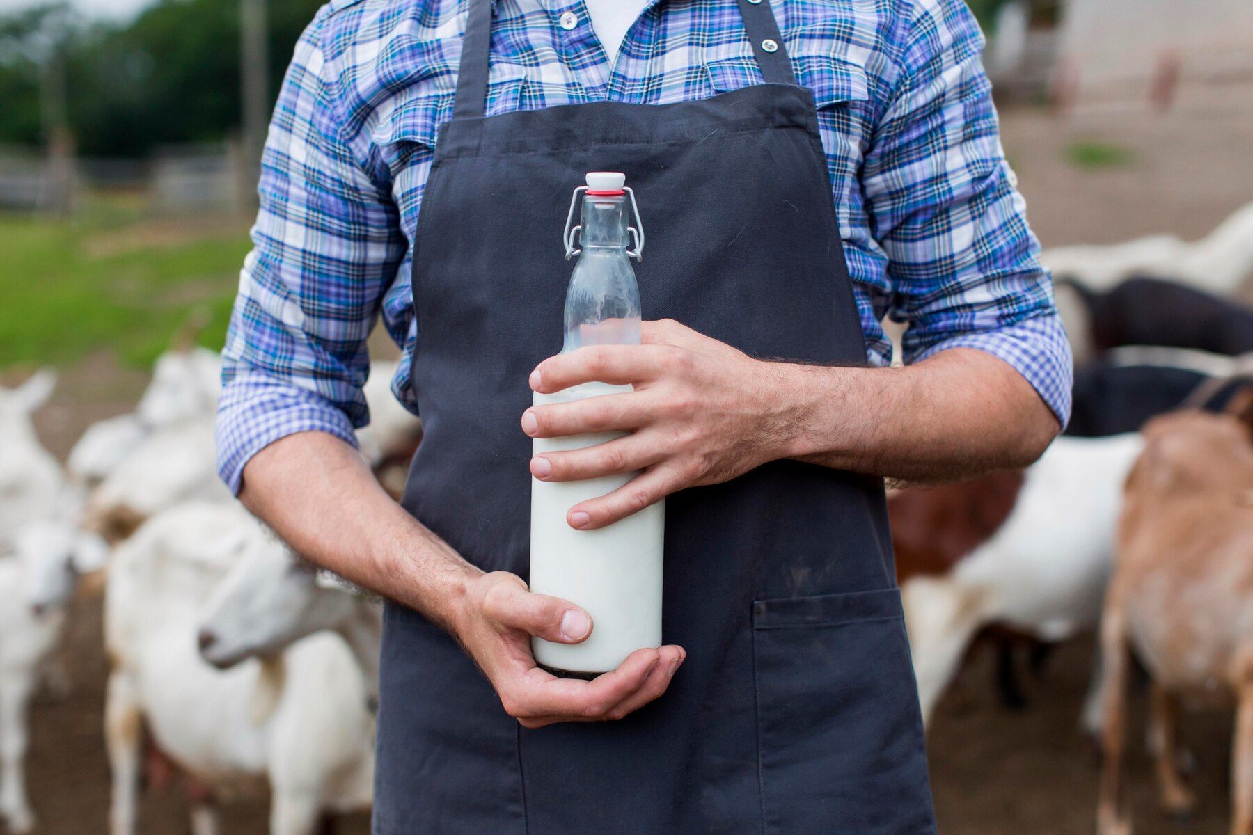 close-up-man-with-bottle-goats-milk_23-2148673055